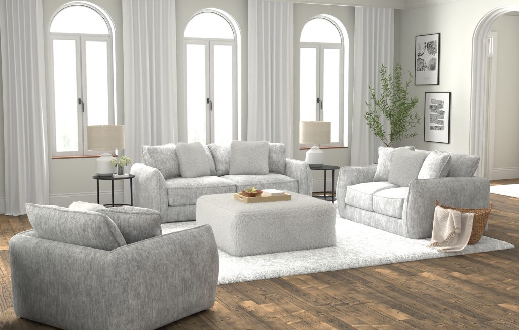 Upholstered sofa set with matching loveseat, armchair, and fluffy ottoman in a bright, modern living room with wood floors and white curtains.